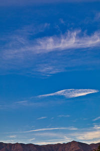 Low angle view of mountain against cloudy sky