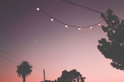 Low angle view of silhouette trees against sky at sunset