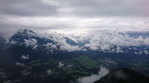 Scenic view of majestic mountains against dramatic sky