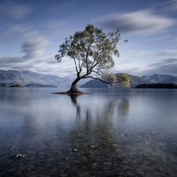 Scenic view of lake with mountains in background