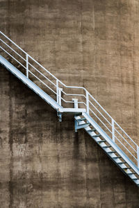 Empty footbridge against wall