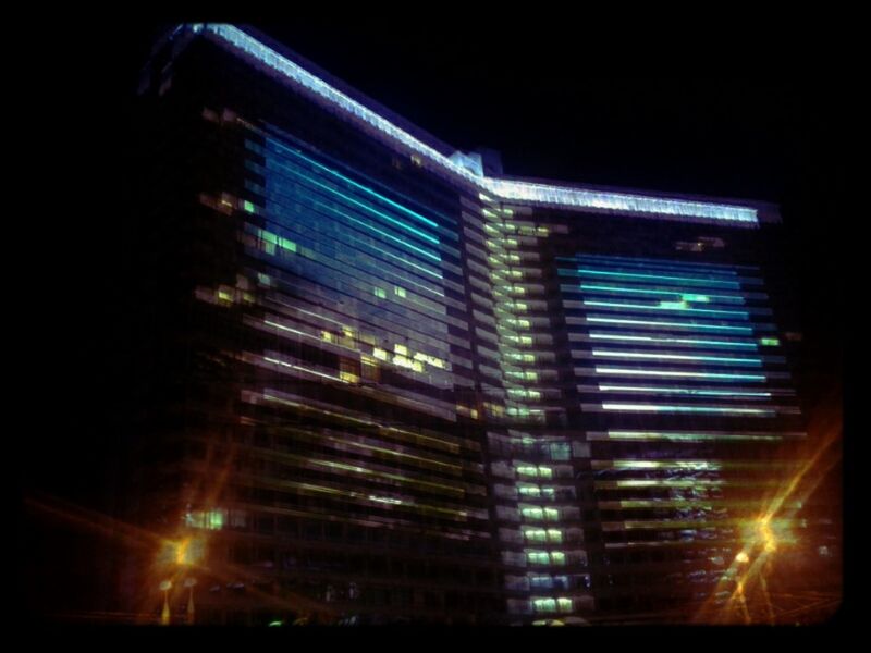 illuminated, night, building exterior, architecture, built structure, city, low angle view, building, modern, lighting equipment, window, office building, skyscraper, dark, light - natural phenomenon, no people, glowing, outdoors, sky, reflection