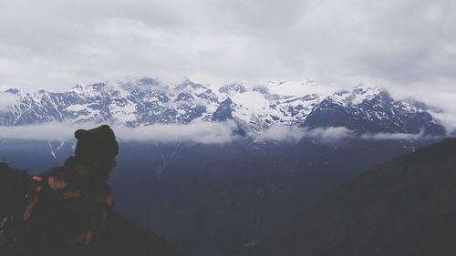 Scenic view of snowcapped mountains against sky