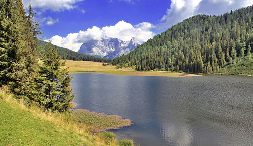 Scenic view of mountains against cloudy sky