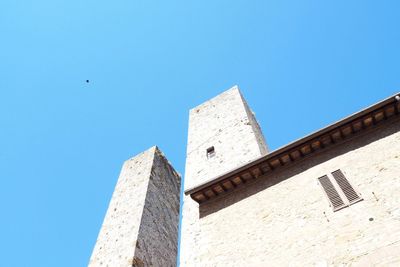 Low angle view of fort against clear blue sky