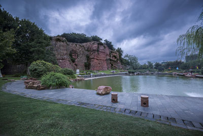 Tranquil view of lake against cloudy sky