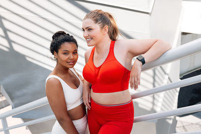 Portrait of young woman exercising in gym