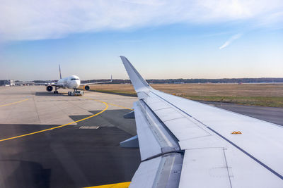 Passenger plane taxiing on runway