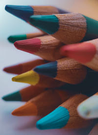 Close-up of multi colored pencils on table