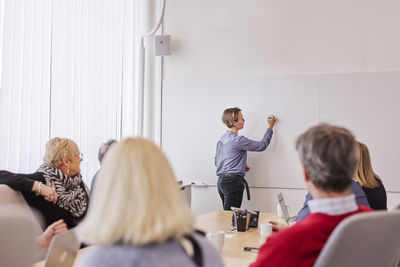 People taking during business meeting