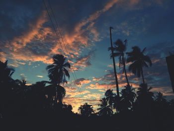 Low angle view of silhouette trees against sky during sunset