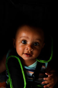 Portrait of cute boy sitting in car