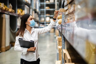 Woman looking at camera in store