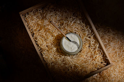 High angle view of clock on wood in box