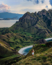 Scenic view of landscape and mountains against sky