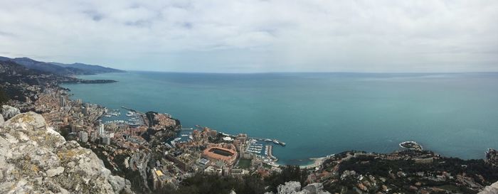 Panoramic view of sea and buildings against sky