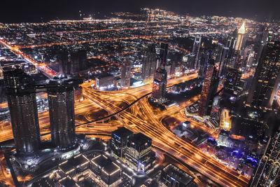 High angle view of illuminated city buildings at night