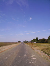 Road by landscape against clear sky