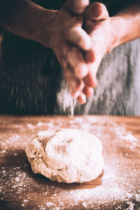 Close-up of man preparing food