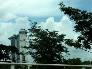 Low angle view of building against cloudy sky