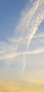 Low angle view of vapor trail against sky