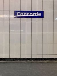 Text on wall at subway station