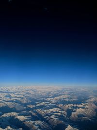 High angle view of landscape against clear blue sky