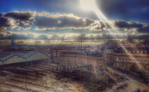 Aerial view of cityscape against sky during sunset