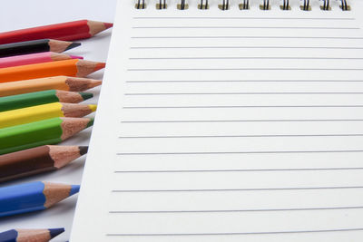 High angle view of multi colored pencils on table