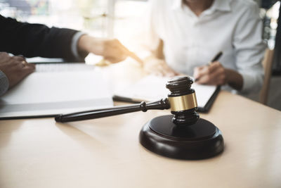 Close-up of people on table