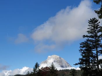 Low angle view of snowcapped mountain against sky