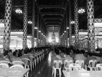 People sitting in illuminated room