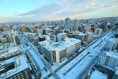 High angle view of buildings in city against sky