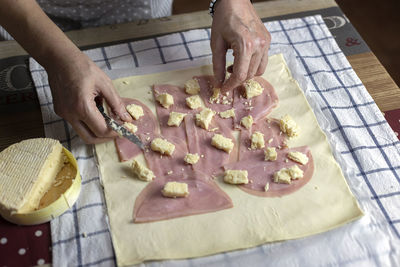 High angle view of person preparing food on cutting board