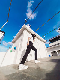 Low angle view of person standing against sky