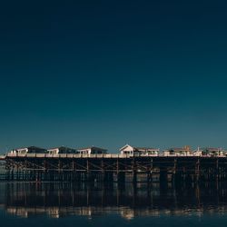 View of harbor against clear sky