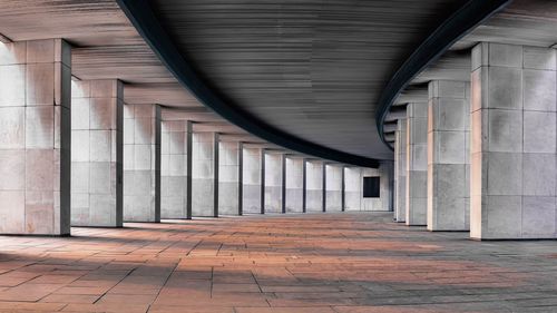 Empty corridor amidst columns