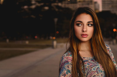 Young woman standing in city