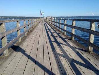 Pier over sea against sky