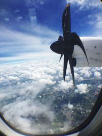 Close-up of airplane wing against sky