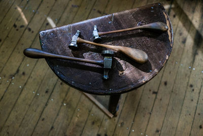 High angle view of old machine part on wooden table