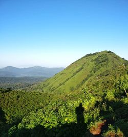 Scenic view of mountains against clear blue sky