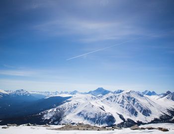 Scenic view of snowcapped mountains against sky