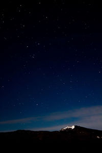 Low angle view of star field sky at night