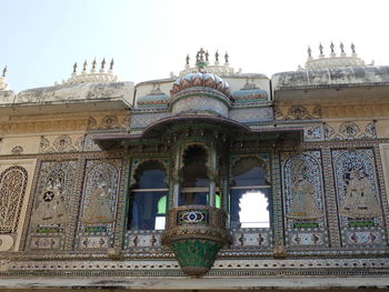 Low angle view of temple against building