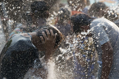 People enjoying at water festival