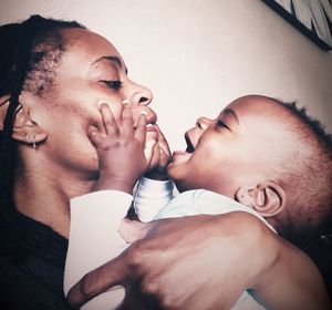 Close-up of happy mother and son