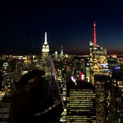 Aerial view of city lit up at night