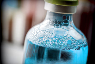 Close-up of water bottle in glass