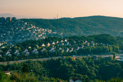 High angle view of trees and buildings against sky